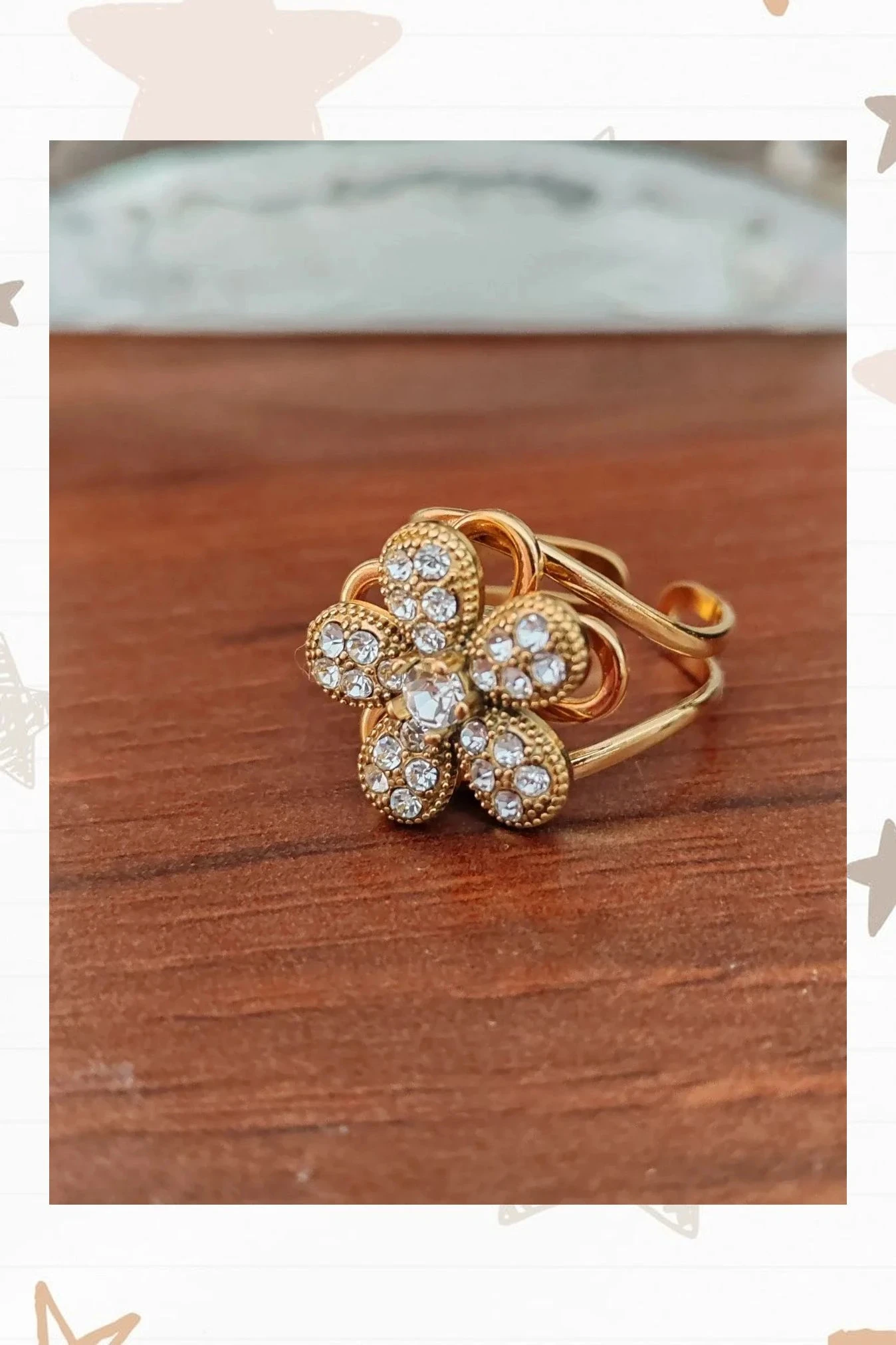 Anillo antiestrés con flor giratoria